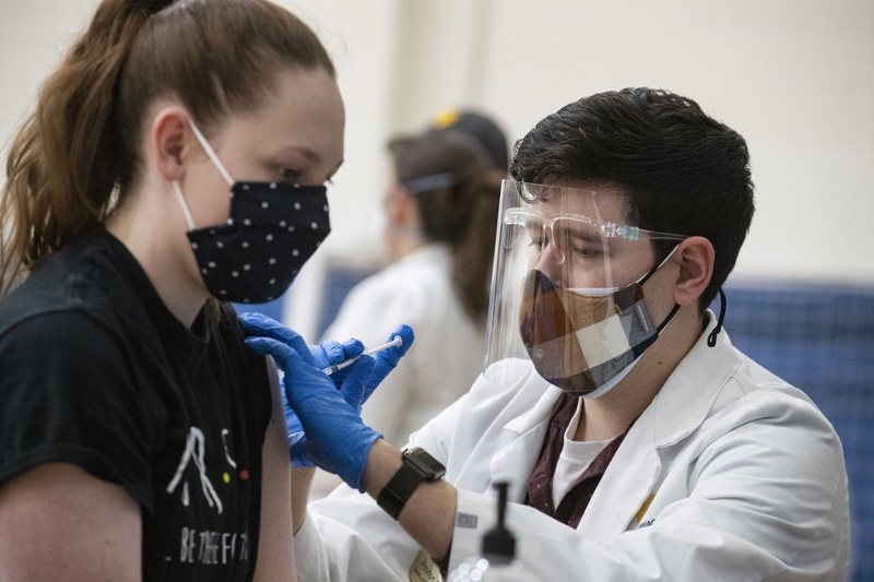 WVU health sciences professional gives COVID vaccine